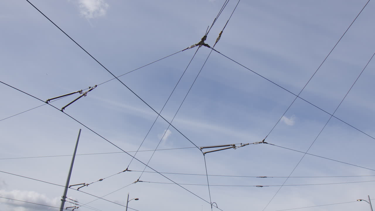 Tram Overhead Lines Against The Blue Sky In Amsterdam, Netherlands. Wide shot