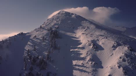 Beautiful-white-winter-mountain-of-Kalavryta-in-Greece---Aerial