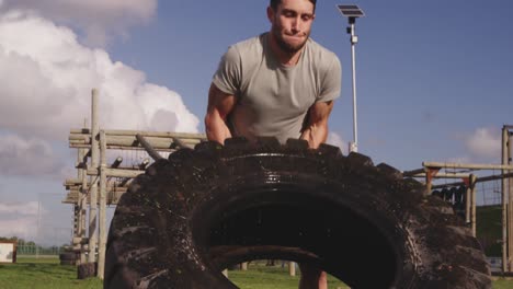 young man training at an outdoor gym bootcamp