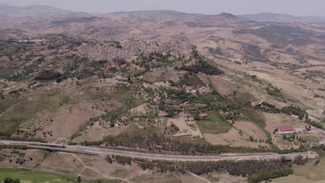 Aerial-view-of-countryside-near-Enna-city-with-Castello-di-Lombardia-on-a-rock-during-day-time,-Sicily,-Italy