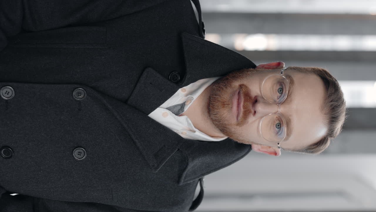 Portrait of a man in a coat and glasses