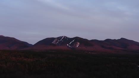 drone aerial beautiful ski mountain alpen glow during sunset 4k 30p