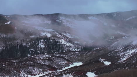 Foggy-Aspen-Snowmass-Pitkin-county-cabin-wilderness-aerial-drone-Rocky-Mountains-Colorado-Basalt-Carbondale-Mt-Sopris-Maroon-Bells-Ashcroft-Independence-Pass-snowy-morning-cloudy-circle-right-snowy