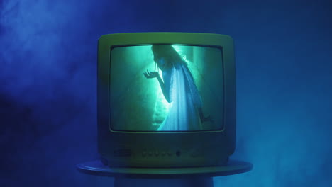 vintage tv with glowing figure