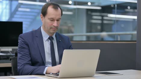 businessman working on laptop in office