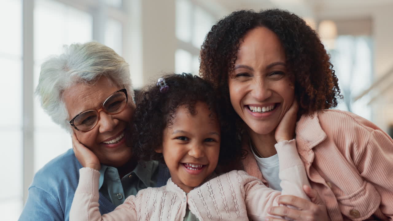 Three generations of a family smiling together