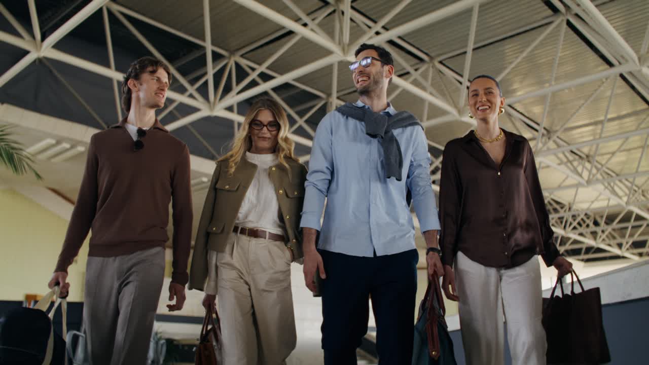 Group of Friends Walking Through Airport