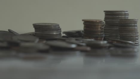 Varied-stacks-of-coins-near-a-pile