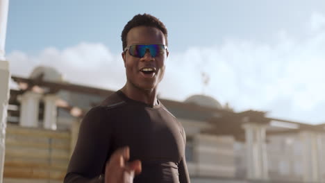 black man, happiness and hand gesture for fitness
