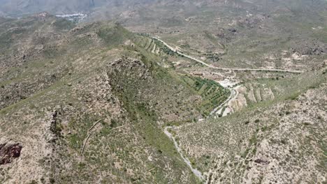 flying high over  a valley in the mountains