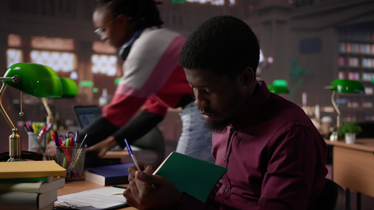 Vertical video african american guy studies for a critical law exam and reading specialty books