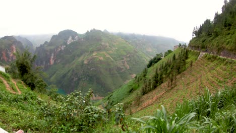 First-person-view-dow-the-side-of-a-mountain-along-the-Ma-Pi-Leng-pass-in-the-misty-mountains-of-northern-Vietnam