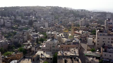 aerial view over golden dome mosque in palestine town biddu,near jerusalem