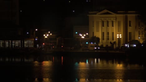 Ambulance-Lighting-Up-a-City-Scape-at-Night-Time