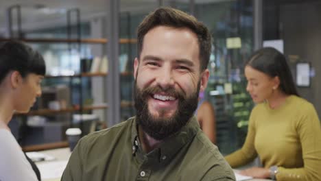 Montage-of-portraits-of-happy-diverse-people-smiling-looking-at-camera