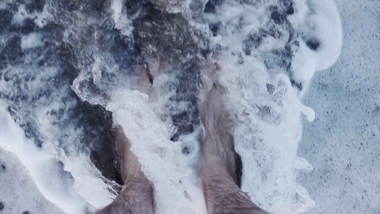 Feet in the ocean