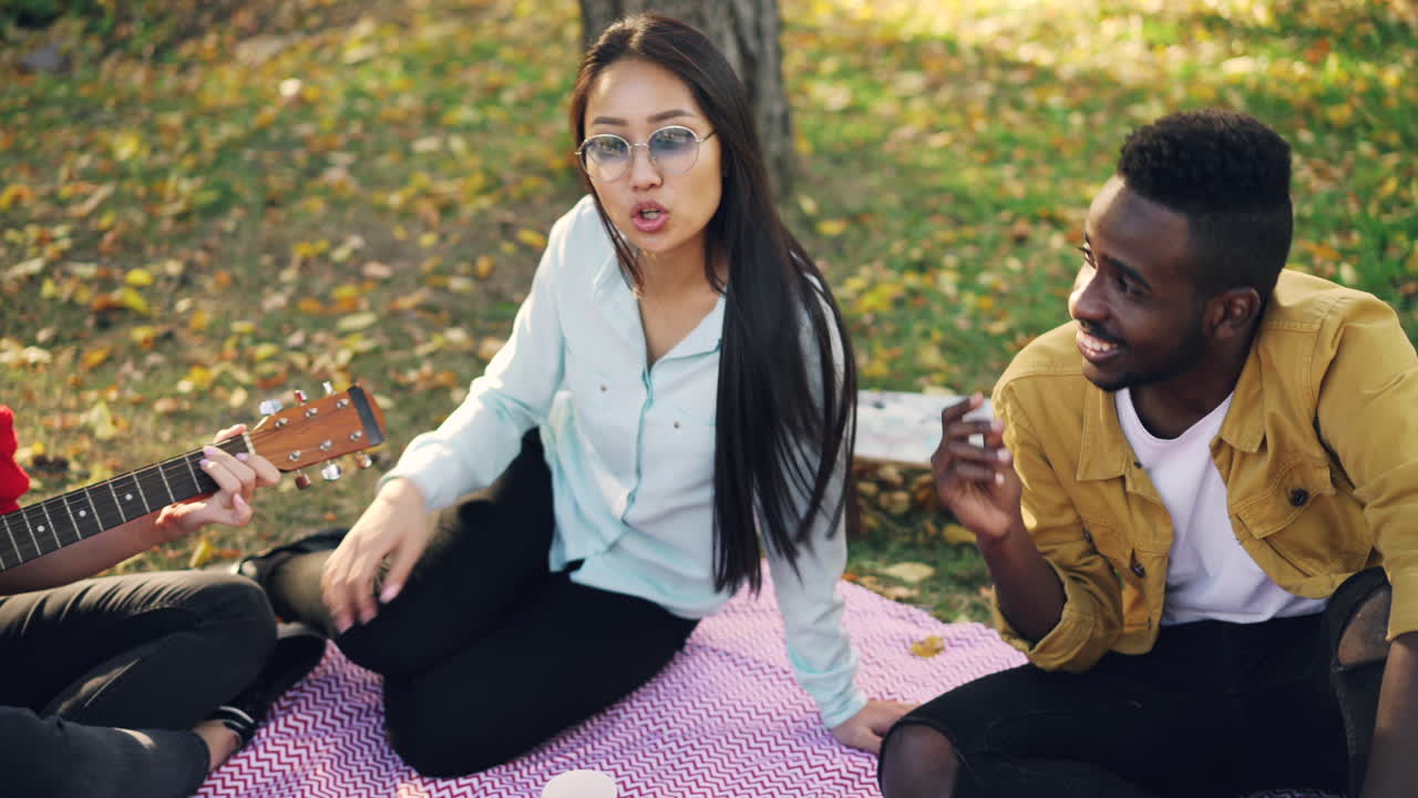 Friends Enjoying Music in a Park