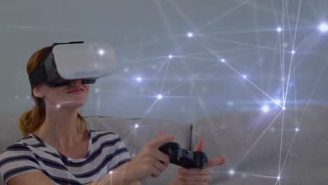 mujer con gafas virtuales mientras juega