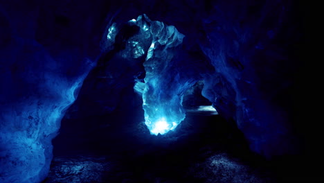 exploring an icy cave illuminated by ethereal blue light in a remote location