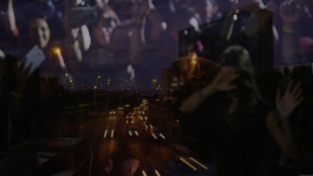 concert crowd filming urban highway at night, with animated data graphics for marketing