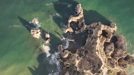 waves washing up on limestone rocks and cliffs, lagos, algarve