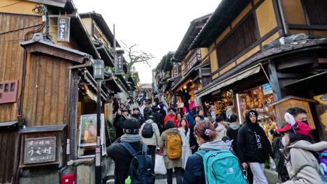 crowded street with tourists and traditional shops