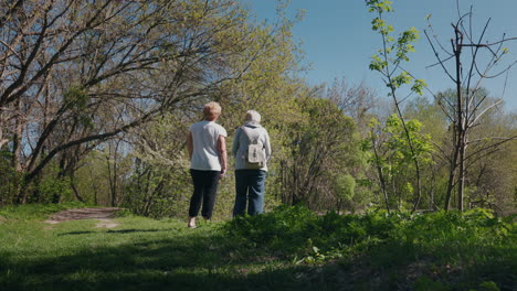 two women walking in a park