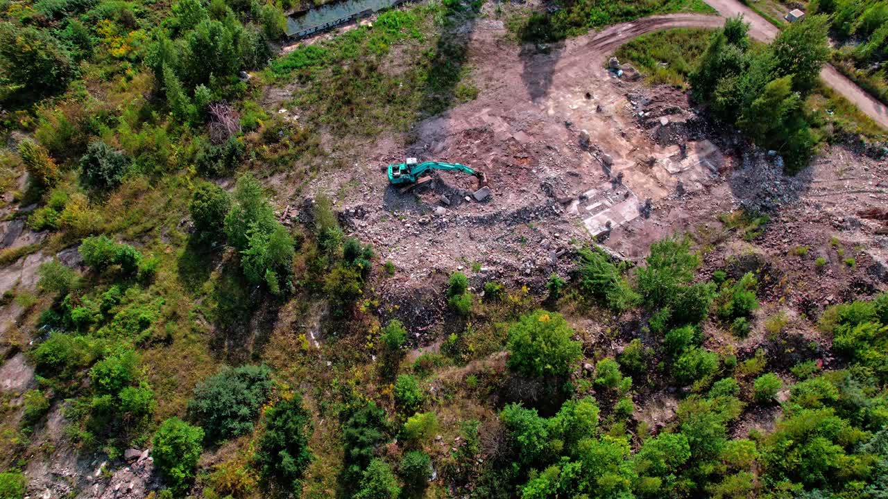 Construction site with excavator in Latvia under clear skies