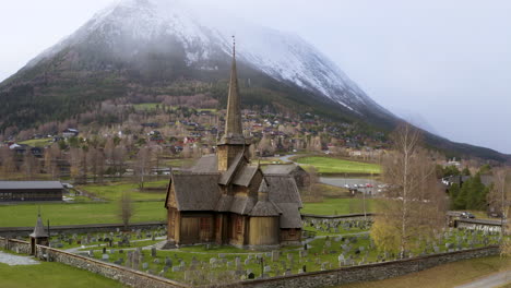 old wooden church in the norwegian town lom - aerial drone shot