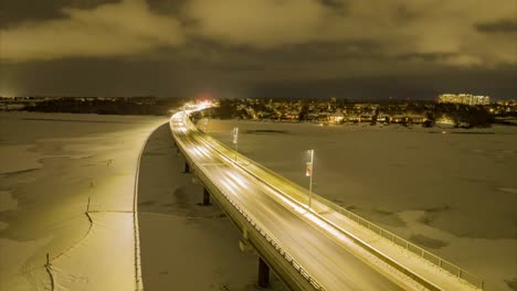 aerial night time timelapse of highway during winter