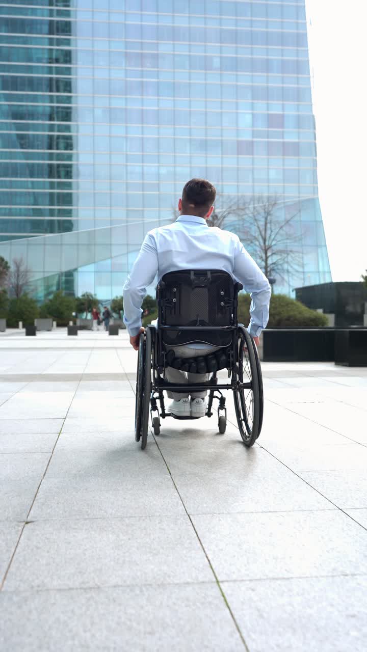 Man in Wheelchair Moving Towards Modern Business Building