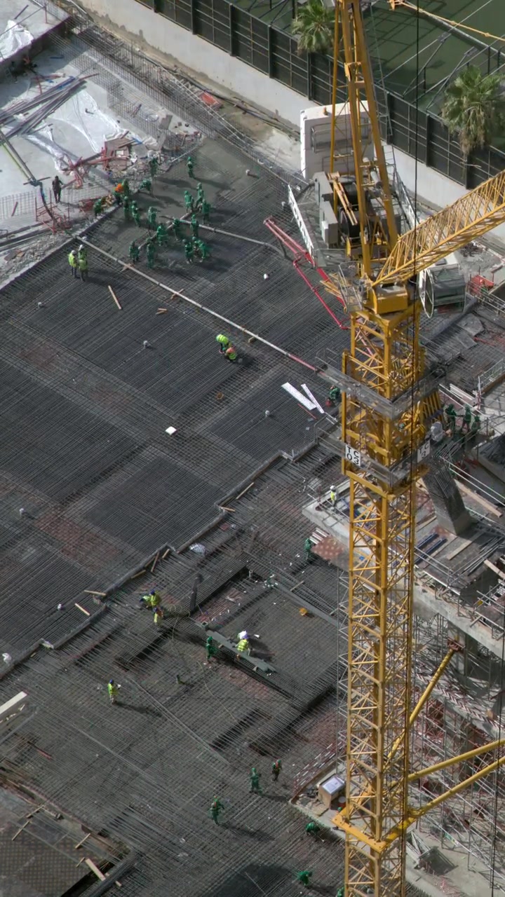 Aerial View of Construction Workers on Building Site