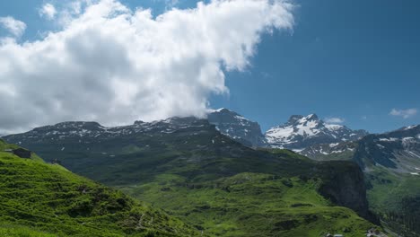 cumulus clouds over swiss alps in the canton of uri in switzerland