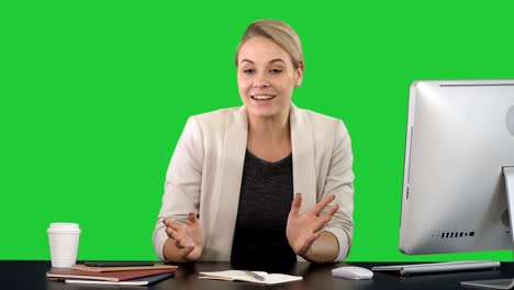 blogging, technology, videoblog, mass media and people concept - happy smiling woman or blogger talking to camera on a green screen, chroma key