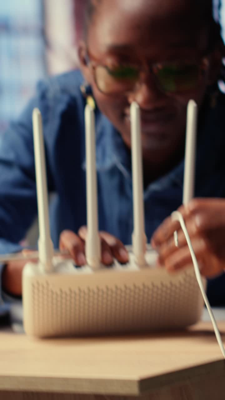 African American Woman Setting Up Wireless Internet Router