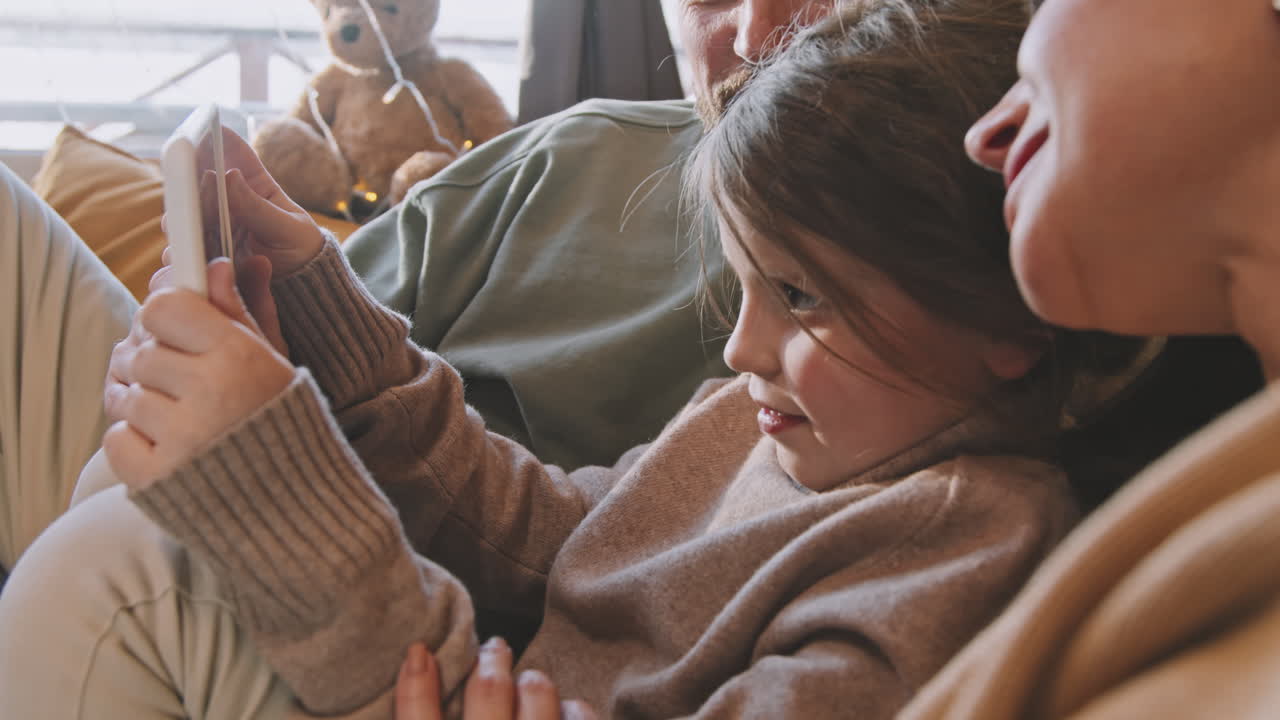 Slowmo of Family of Three Using Tablet at Home