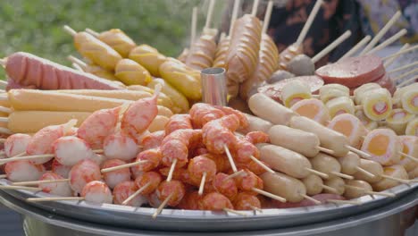delicious street food variety: grilled sausages, meatballs and skewers