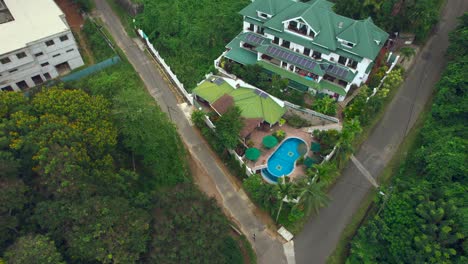 Mahe-Seychelles-drone-shot-of-residential-area-and-touristic-accommodation,-a-small-village-on-Mahe-Island-in-the-north-coast