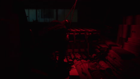 worker in a dark warehouse