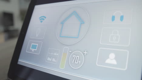 temperature in living room is regulated and set using smart home app on tablet screen
