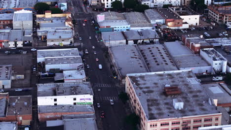 aerial view of urban cityscape with streets, buildings, and traffic