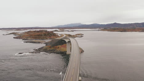 aerial view of famous atlantic ocean road with cloudy sky in norway