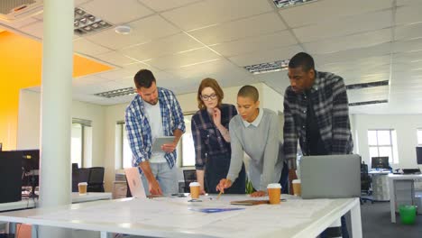 young mixed race business team discussing over graphs in modern office 4k