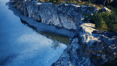 Stunning riverbank view under clear sky capturing natural beauty at dusk