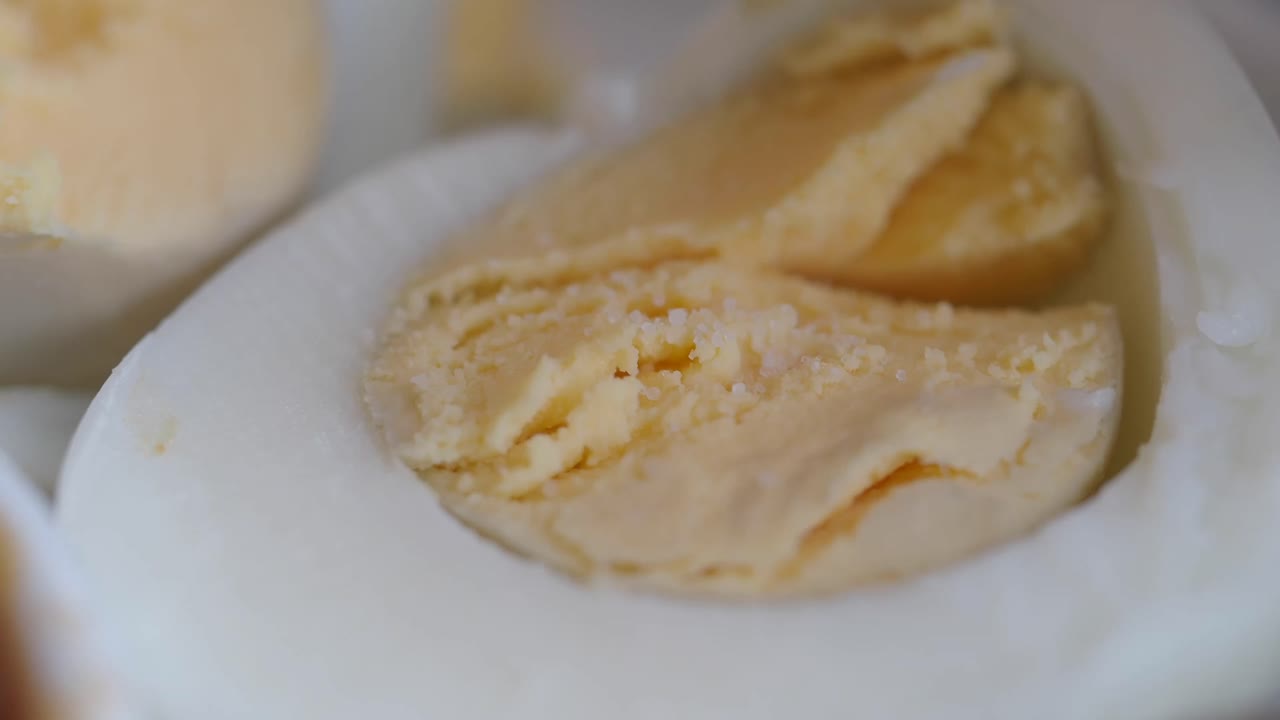Close-up of a boiled egg with salt