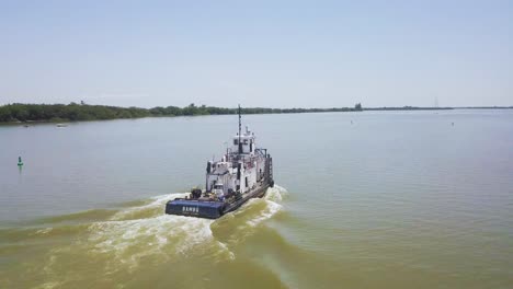 industrial boat sailing up jacui river, brazil