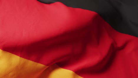 Animation-of-football-over-flag-of-germany-with-copy-space