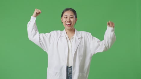 excited female scientist in lab coat