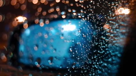 car side mirror with rain drops