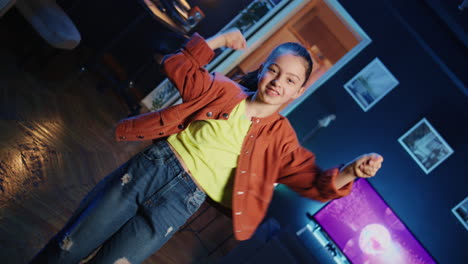 dutch angle shot of expressive kid taking part in viral dance trend for internet channel